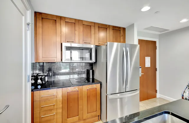 a view of a workspace with a window and couch