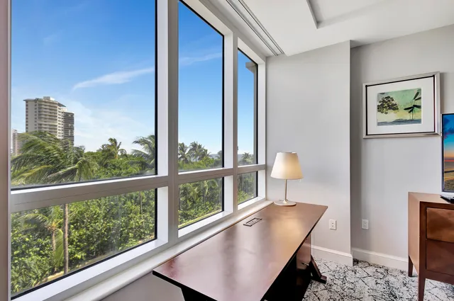 a view of a balcony with furniture