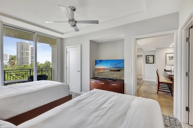 a view of a table and chairs under an umbrella in patio