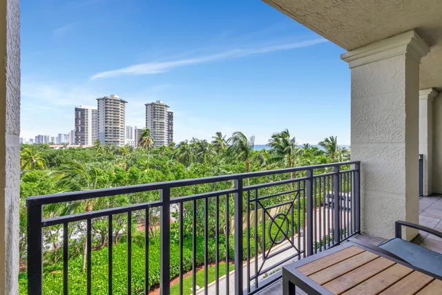 a view of a swimming pool with a lawn chairs and a yard