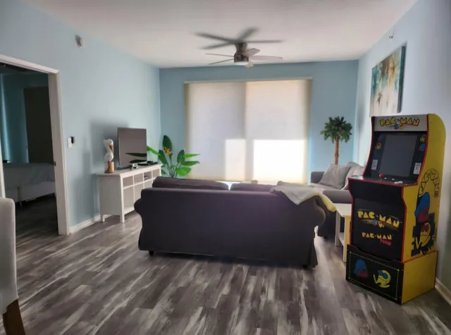 a living room with furniture and a flat screen tv