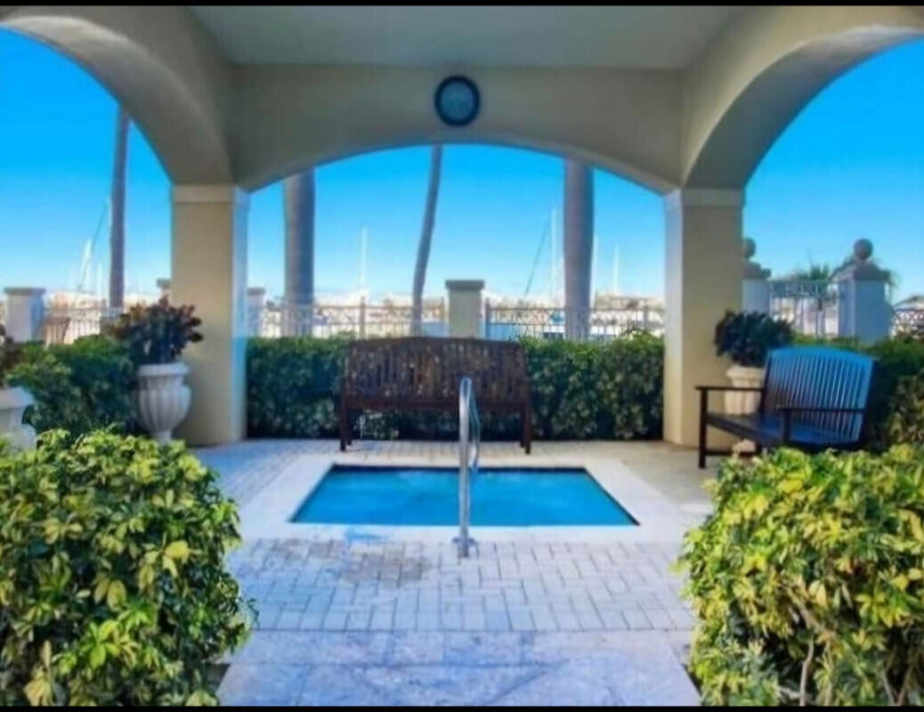 802 West Windward Way, Unit 309 Lantana, FL 33462 - Photo 7 of 10 a view of a porch with chairs and potted plants