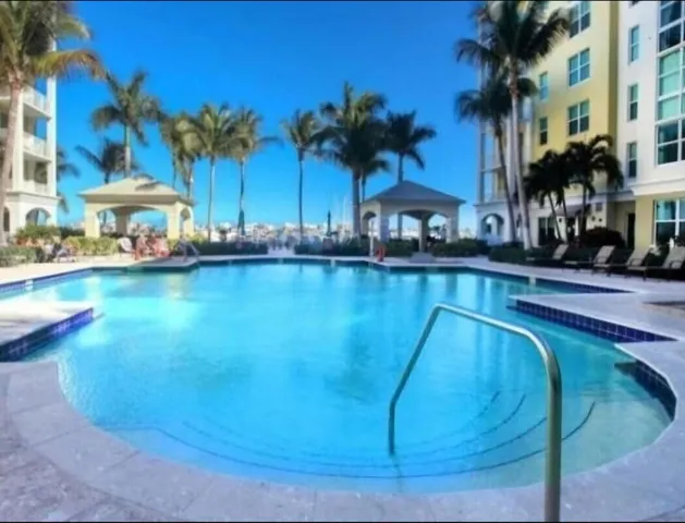 a view of a swimming pool and a yard