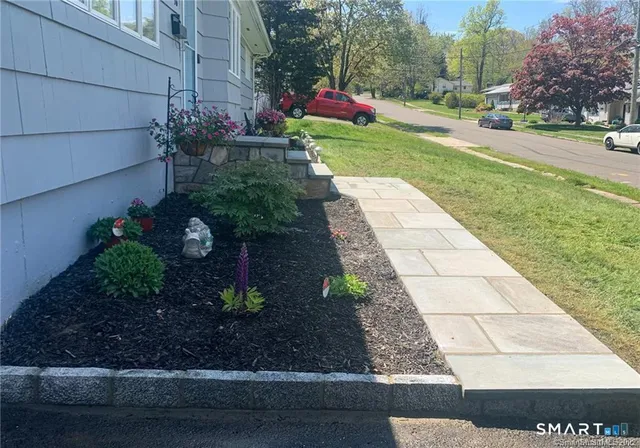 a view of a backyard with sitting area