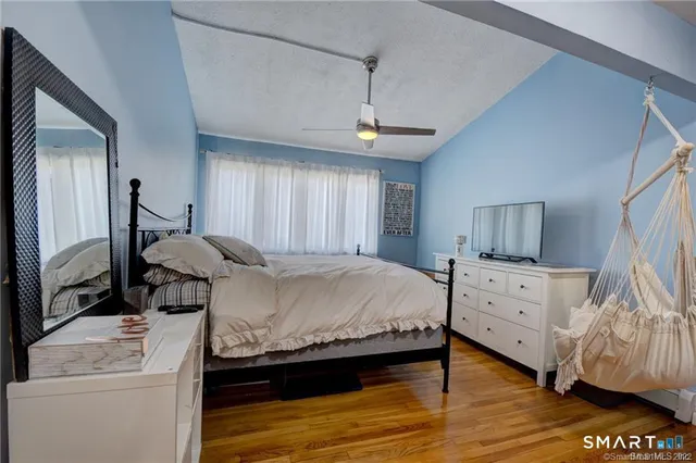 a bed room with a bed and a window