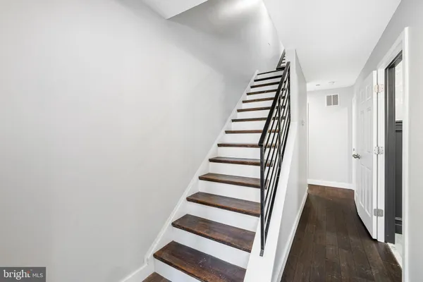 a view of a hallway with staircase