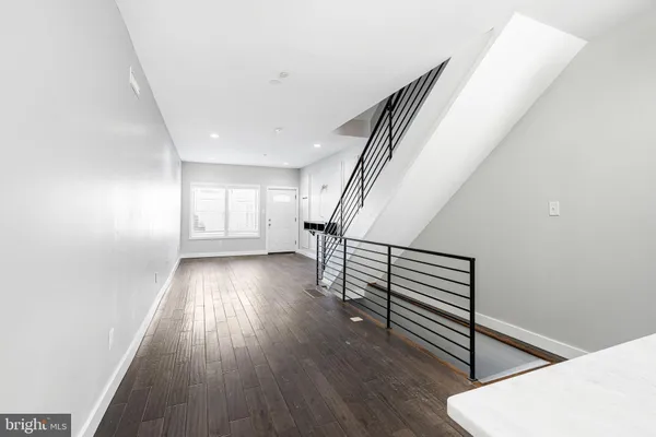 a view of entryway with wooden floor