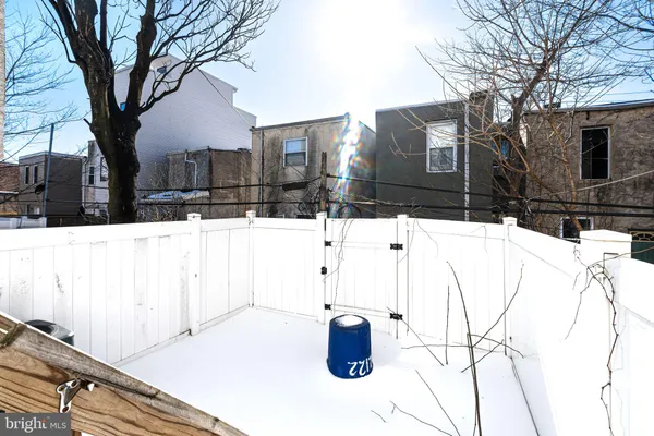 a view of a house with snow in between