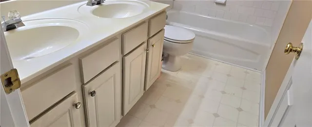 a bathroom with a sink and shower