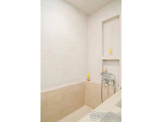 a bathroom with a bathtub and a sink