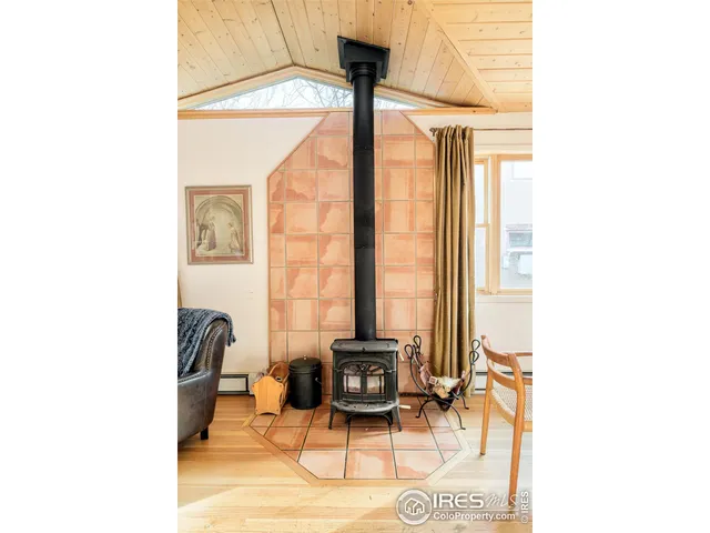 a living room with furniture and large windows