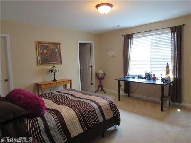 5540 Folkstone Road Pfafftown, NC 27040 - Photo 14 of 16 3rd Bedroom. Large Bedroom w/ Walk-In Closet and Buddy Bath
