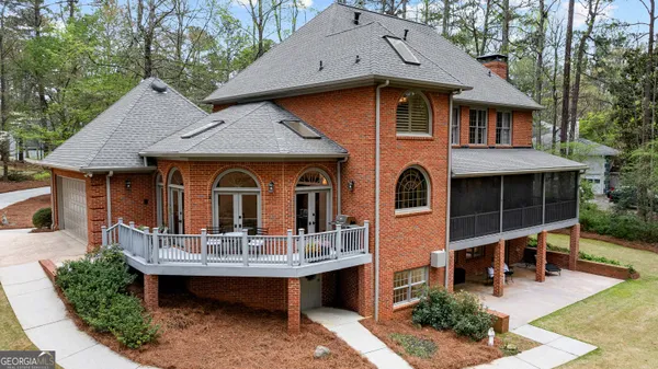 a front view of a house with yard and green space