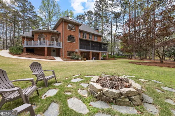 an aerial view of a house with outdoor space