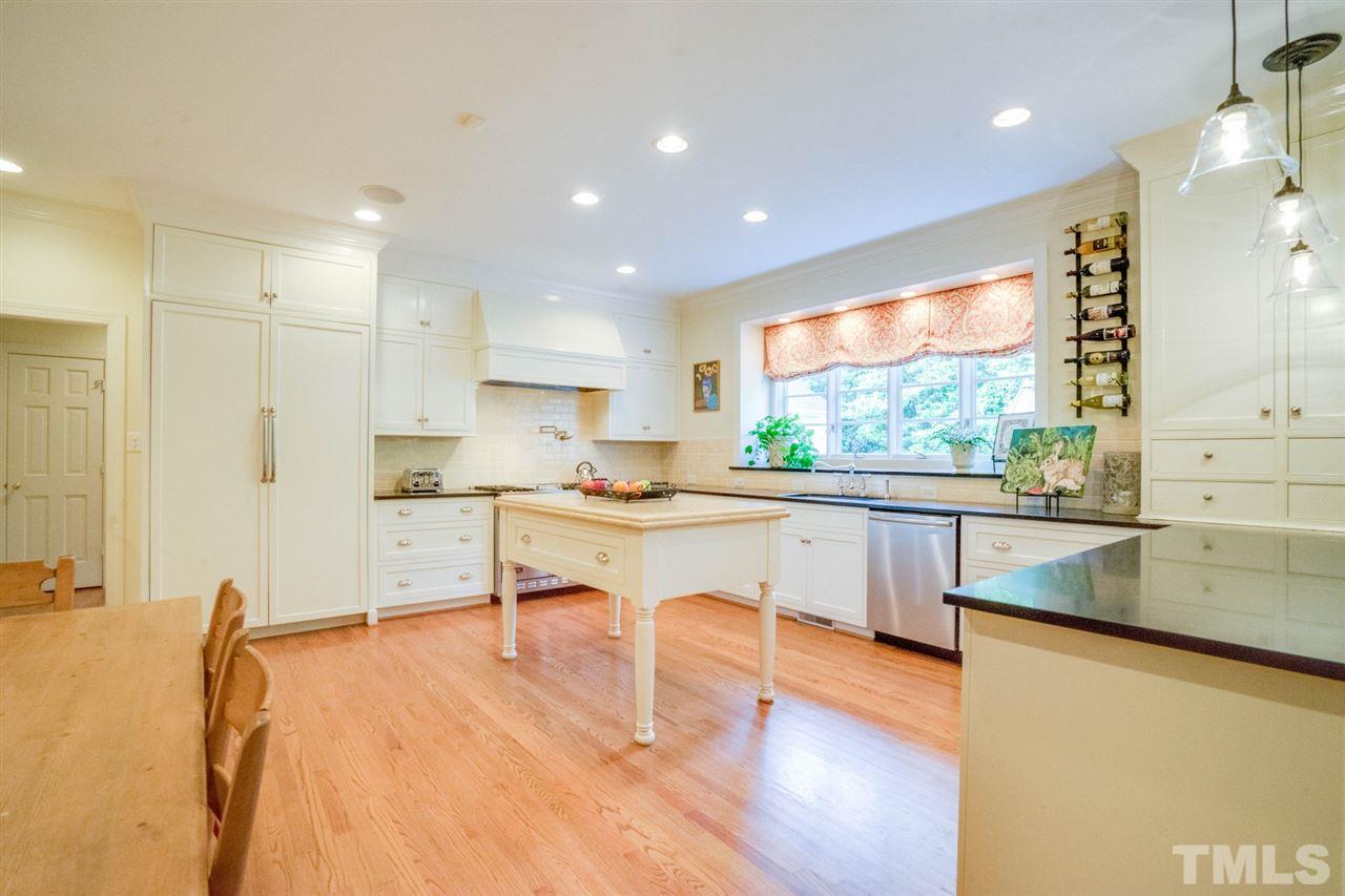 700 Yarmouth Road Raleigh, NC 27607 - Photo 12 of 25 a large white kitchen with a large window