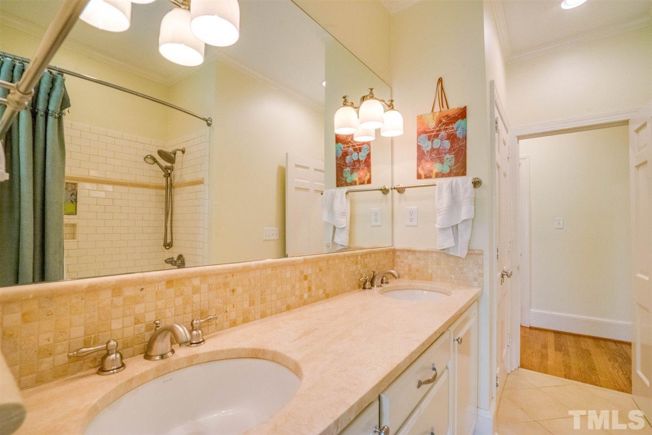 700 Yarmouth Road Raleigh, NC 27607 - Photo 18 of 25 a bathroom with a sink and a mirror