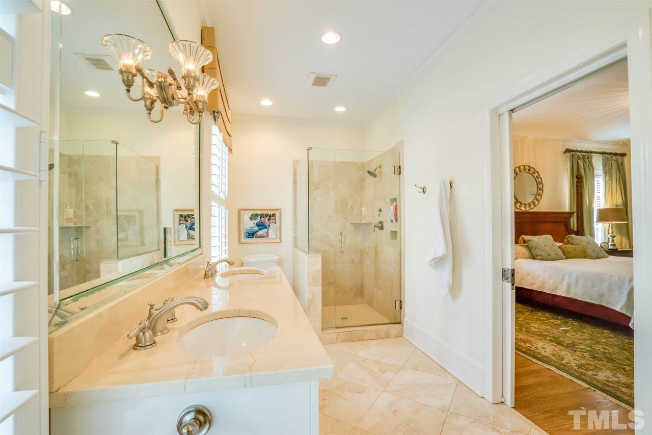700 Yarmouth Road Raleigh, NC 27607 - Photo 21 of 25 a bathroom with a tub sink and shower