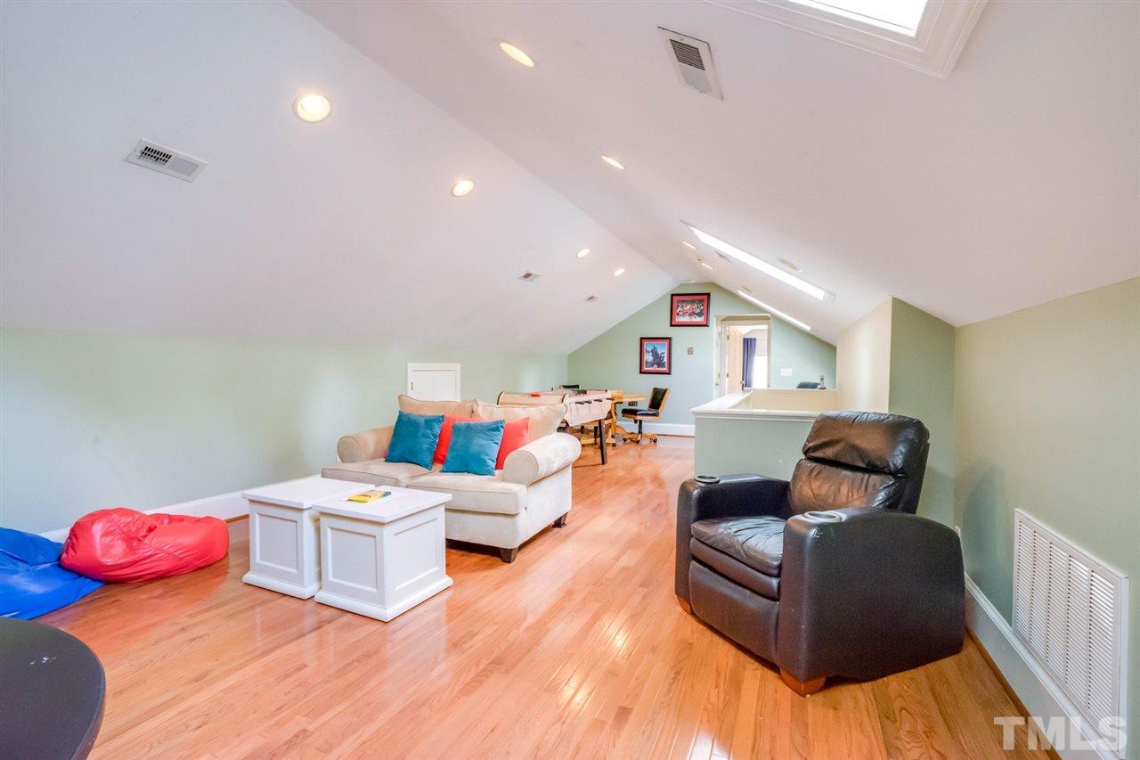 700 Yarmouth Road Raleigh, NC 27607 - Photo 23 of 25 a living room with furniture and wooden floor