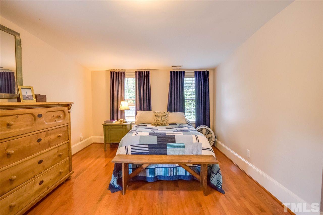 700 Yarmouth Road Raleigh, NC 27607 - Photo 24 of 25 a living room with furniture and large windows