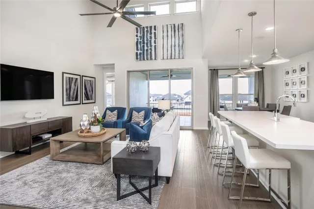 a kitchen with kitchen island white cabinets and stainless steel appliances