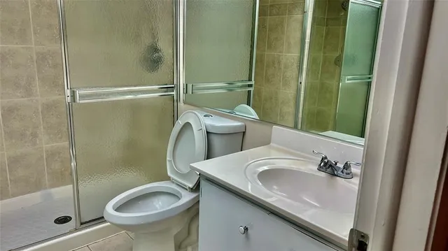 a bathroom with a toilet and shower