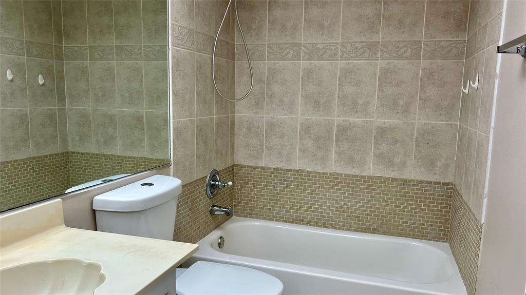 1874 Southwest 81st Lane, Unit 1874 Davie, FL 33324 - Photo 13 of 21 a bathroom with a toilet and shower