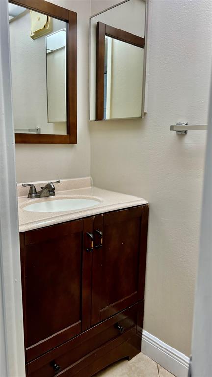 1874 Southwest 81st Lane, Unit 1874 Davie, FL 33324 - Photo 20 of 21 a bathroom with a sink and a mirror