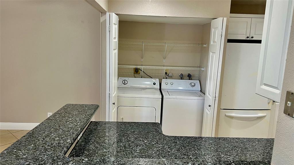 1874 Southwest 81st Lane, Unit 1874 Davie, FL 33324 - Photo 2 of 21 a utility room with a washer and dryer
