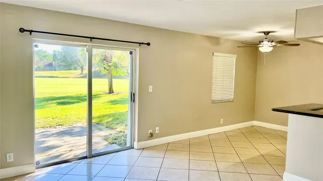 a view of a kitchen with kitchen sink and cabinets