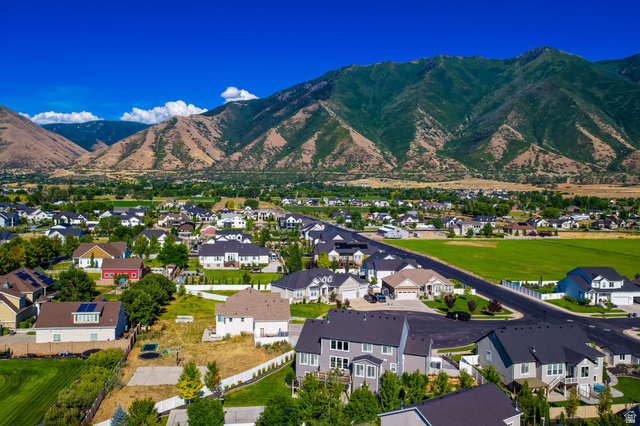 1132 South 1300th Street West Mapleton, UT 84664 - Photo 50 of 52 Residential neighborhood featuring varied architectural styles and mature landscaping, framed by mountainous terrain