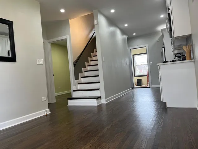 a view of entryway with wooden floor
