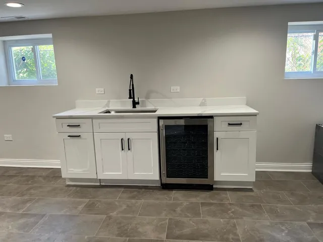 a view of a kitchen with a sink and a stove