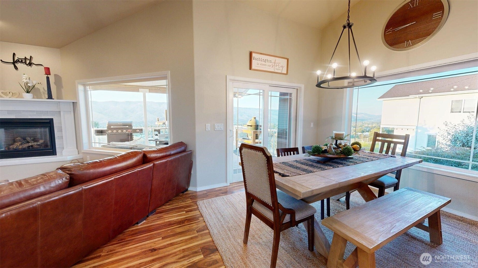1724 Ridgeview Drive Clarkston, WA 99403 - Photo 4 of 38 a dining room with wooden floor a chandelier a wooden table and chairs