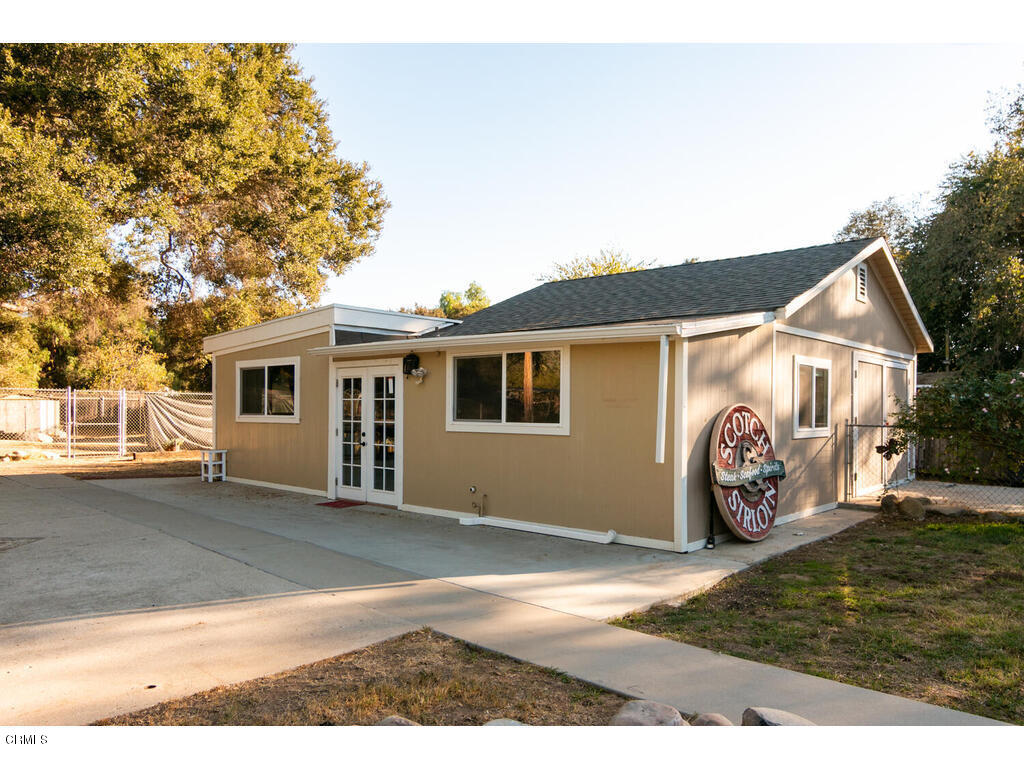 564 Burnham Road Oak View, CA 93022 - Photo 3 of 37 a view of a grey house with a yard