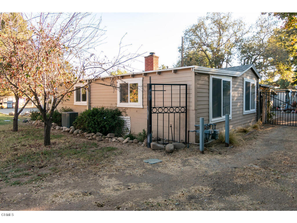 564 Burnham Road Oak View, CA 93022 - Photo 32 of 37 a view of a small yard in front of a house with large trees
