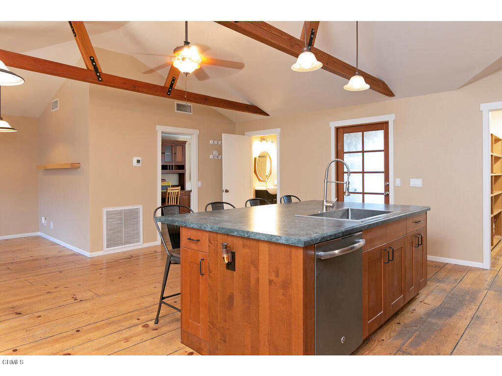 564 Burnham Road Oak View, CA 93022 - Photo 8 of 37 a dining hall with granite countertop a stove a sink dishwasher and a wooden cabinets