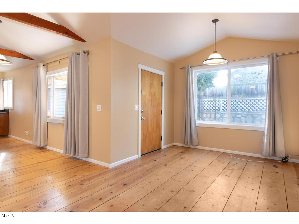 564 Burnham Road Oak View, CA 93022 - Photo 10 of 37 a view of an empty room with wooden floor and a window