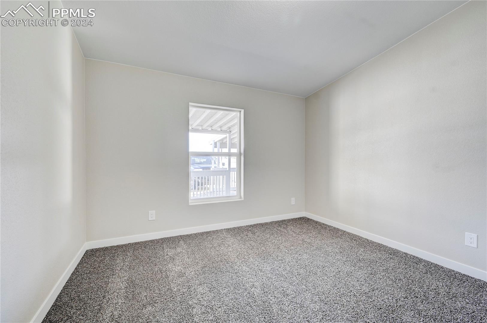 6605 Rio Road Peyton, CO 80831 - Photo 22 of 45 View of carpeted empty room