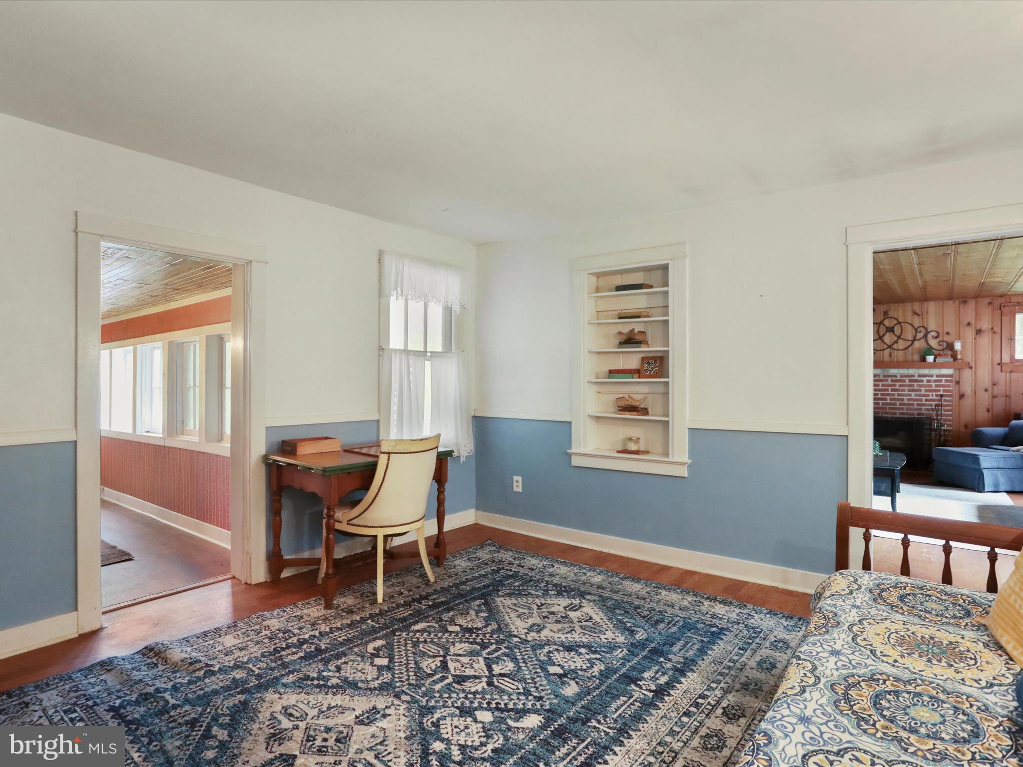 1485 Compton Hollow Road Rileyville, VA 22650 - Photo 13 of 55 a bedroom with a bed and a chair