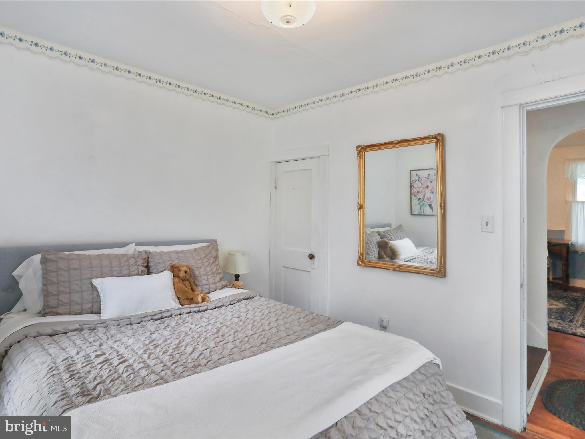 1485 Compton Hollow Road Rileyville, VA 22650 - Photo 20 of 55 a bedroom with a bed and wooden floor