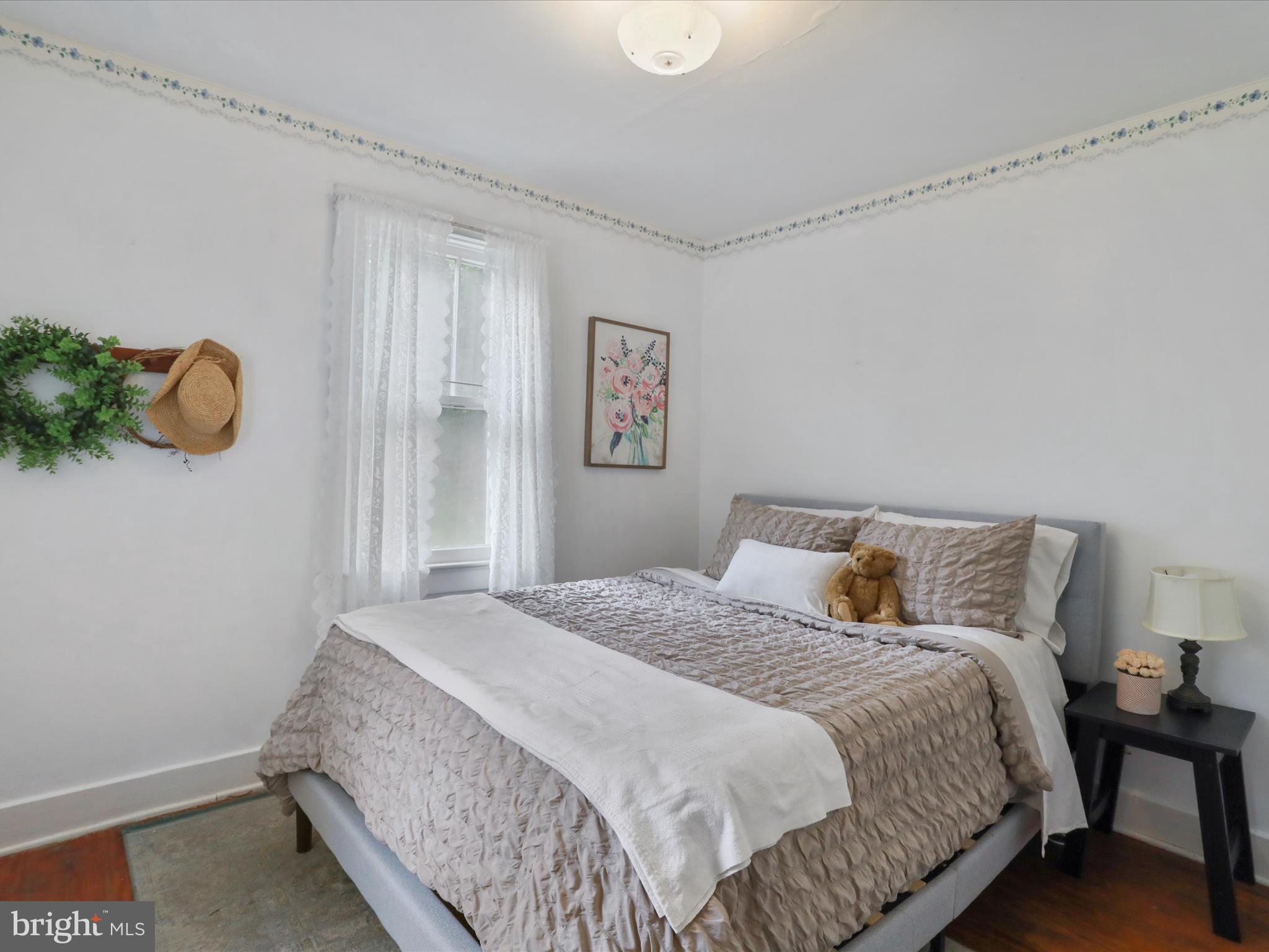 1485 Compton Hollow Road Rileyville, VA 22650 - Photo 21 of 55 a bedroom with a bed and a window
