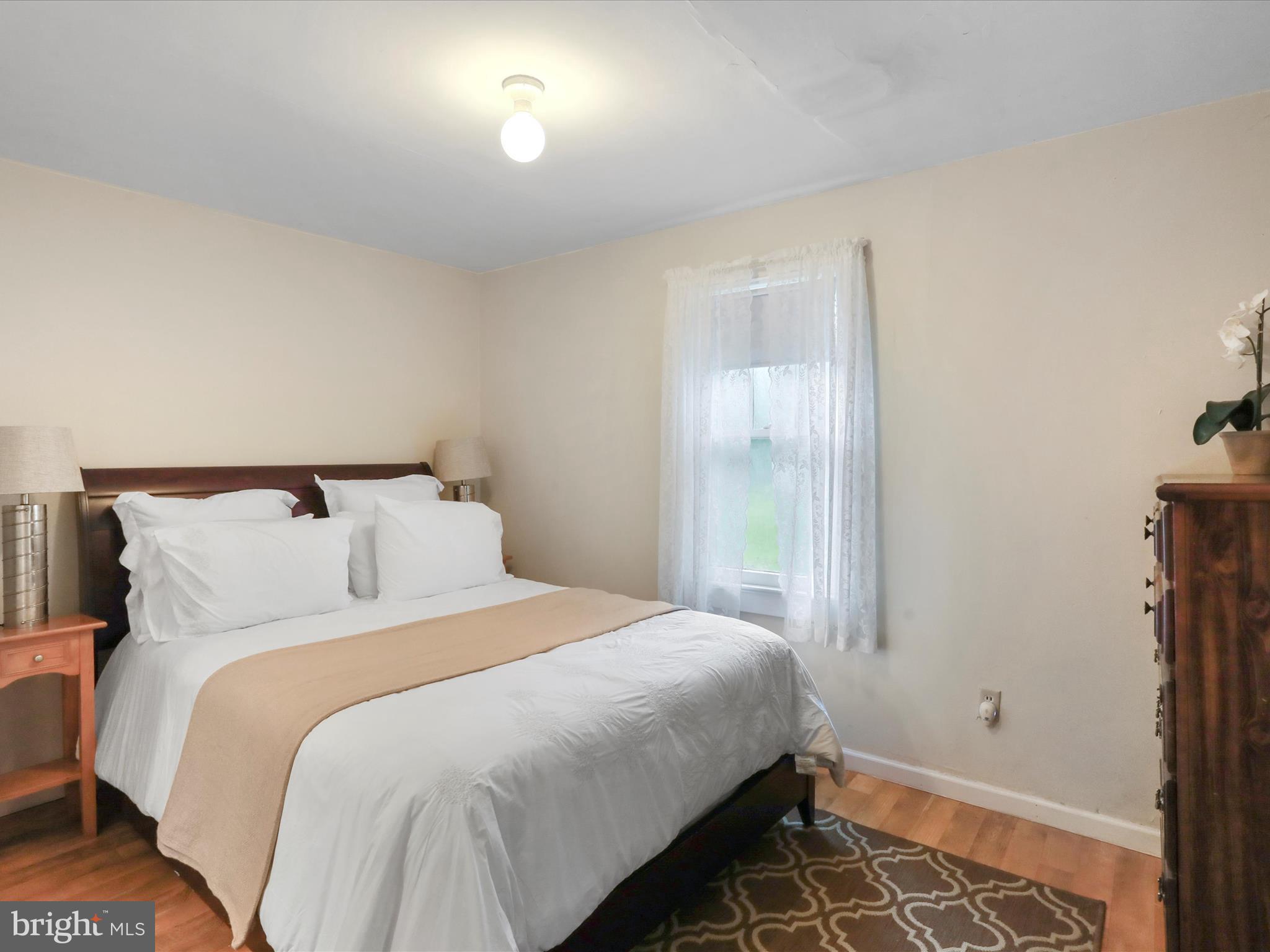 1485 Compton Hollow Road Rileyville, VA 22650 - Photo 23 of 55 a bedroom with a bed and a window