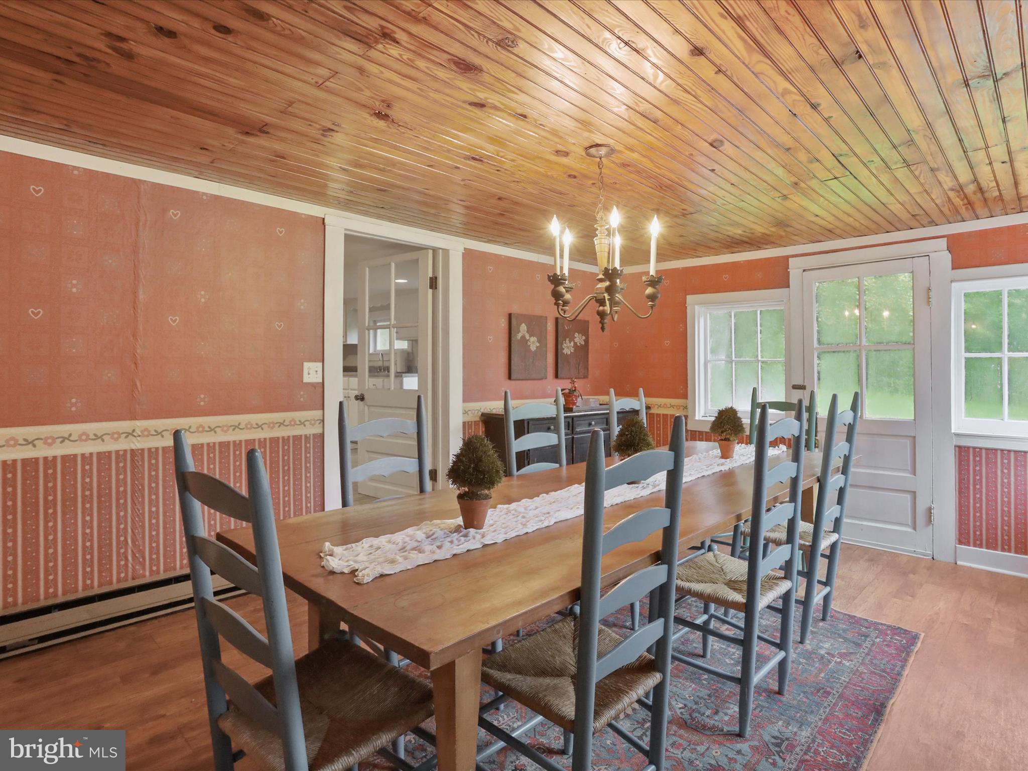 1485 Compton Hollow Road Rileyville, VA 22650 - Photo 28 of 55 a dining room with furniture window and wooden floor