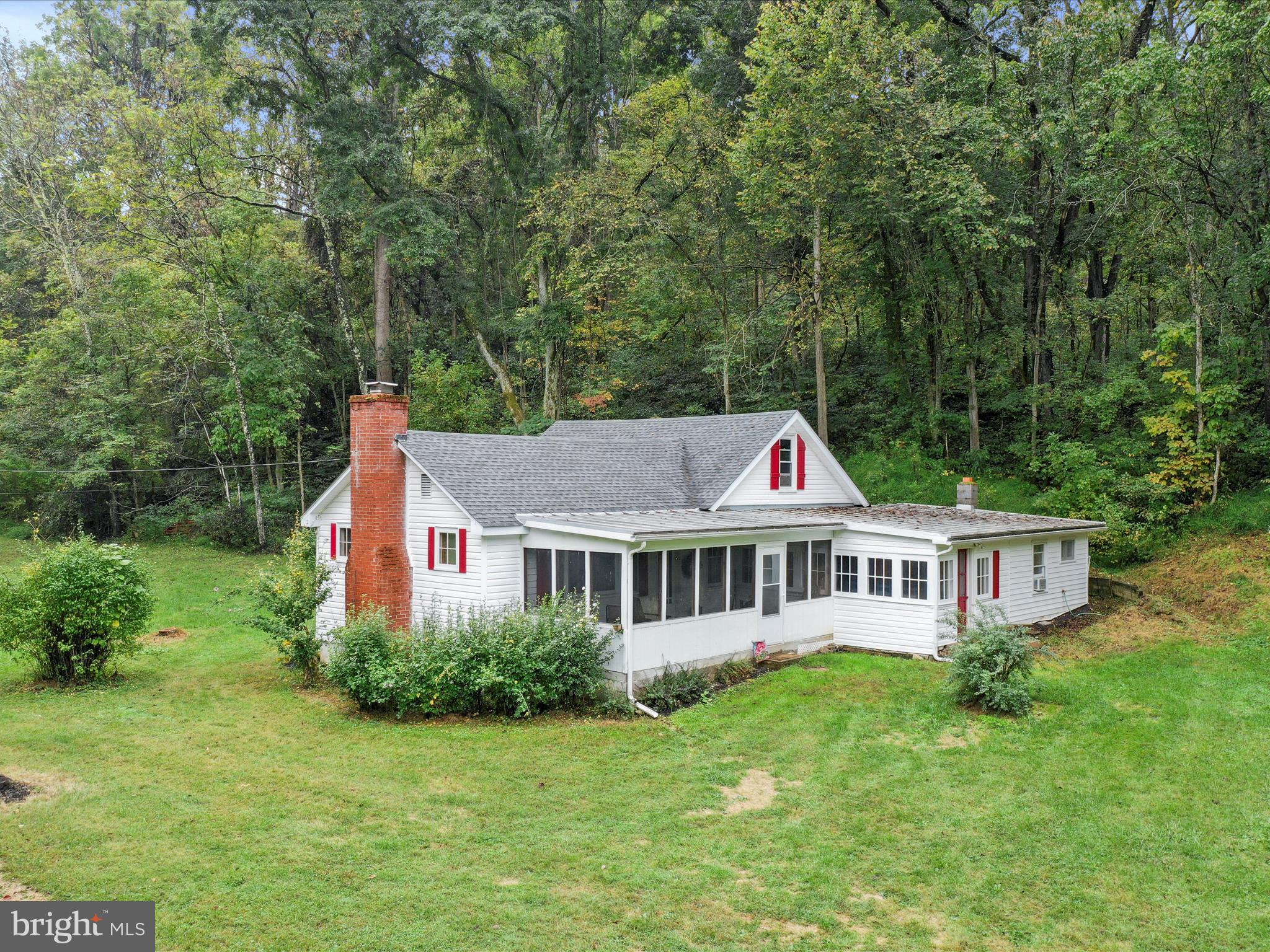 1485 Compton Hollow Road Rileyville, VA 22650 - Photo 47 of 55 a front view of a house with a yard table and chairs
