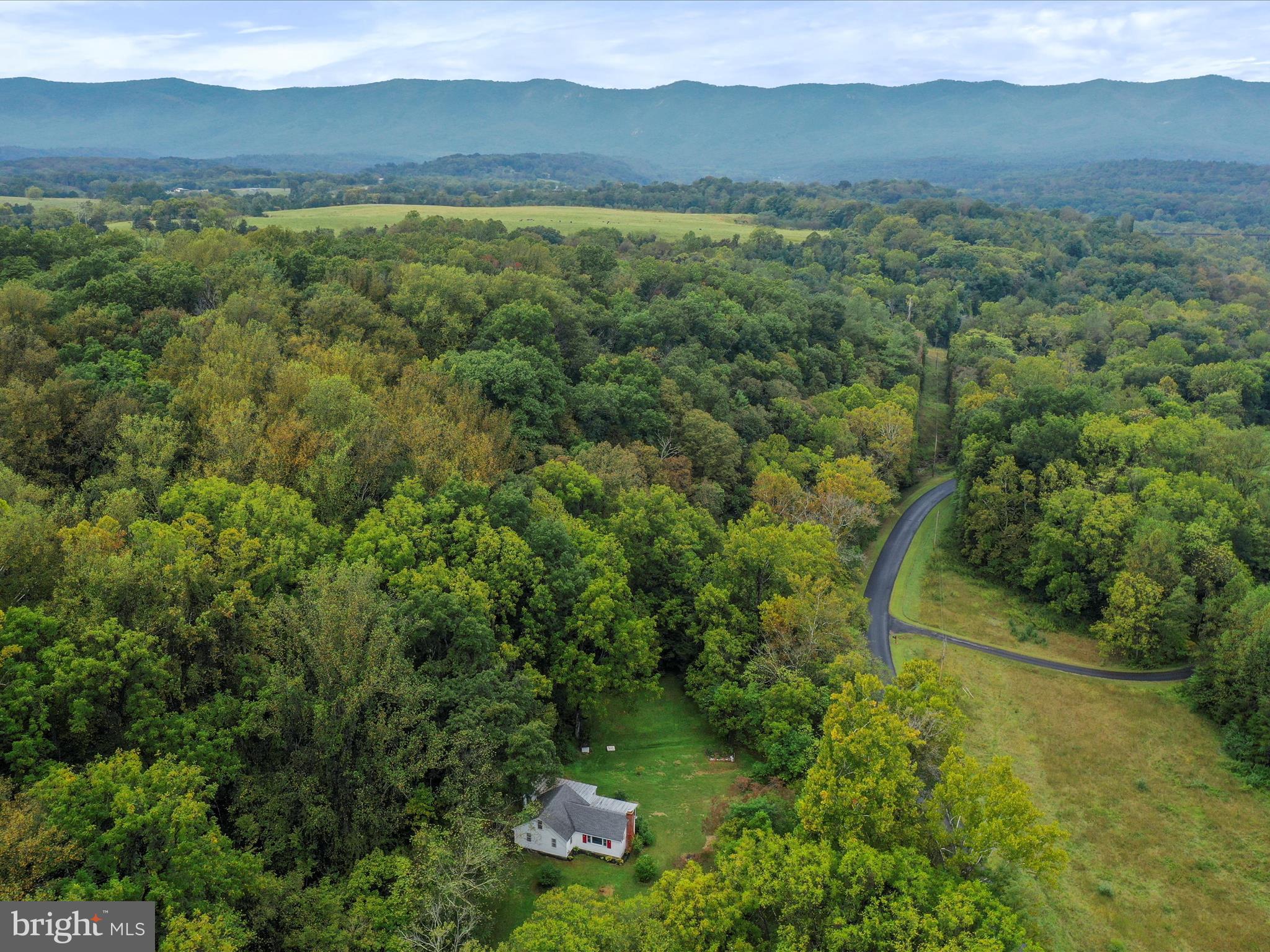 1485 Compton Hollow Road Rileyville, VA 22650 - Photo 52 of 55 a view of a lush green hillside and a yard