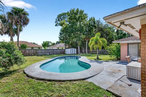 a view of a swimming pool with a patio