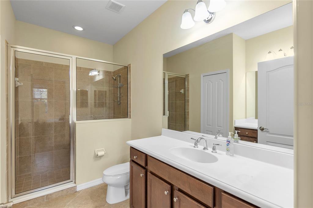 8141 Miramar Way, Unit 8141 Lakewood Ranch, FL 34202 - Photo 13 of 26 a bathroom with a sink a toilet and shower