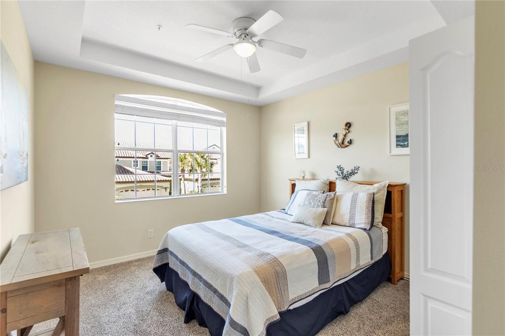 8141 Miramar Way, Unit 8141 Lakewood Ranch, FL 34202 - Photo 15 of 26 a bedroom with a bed and a window