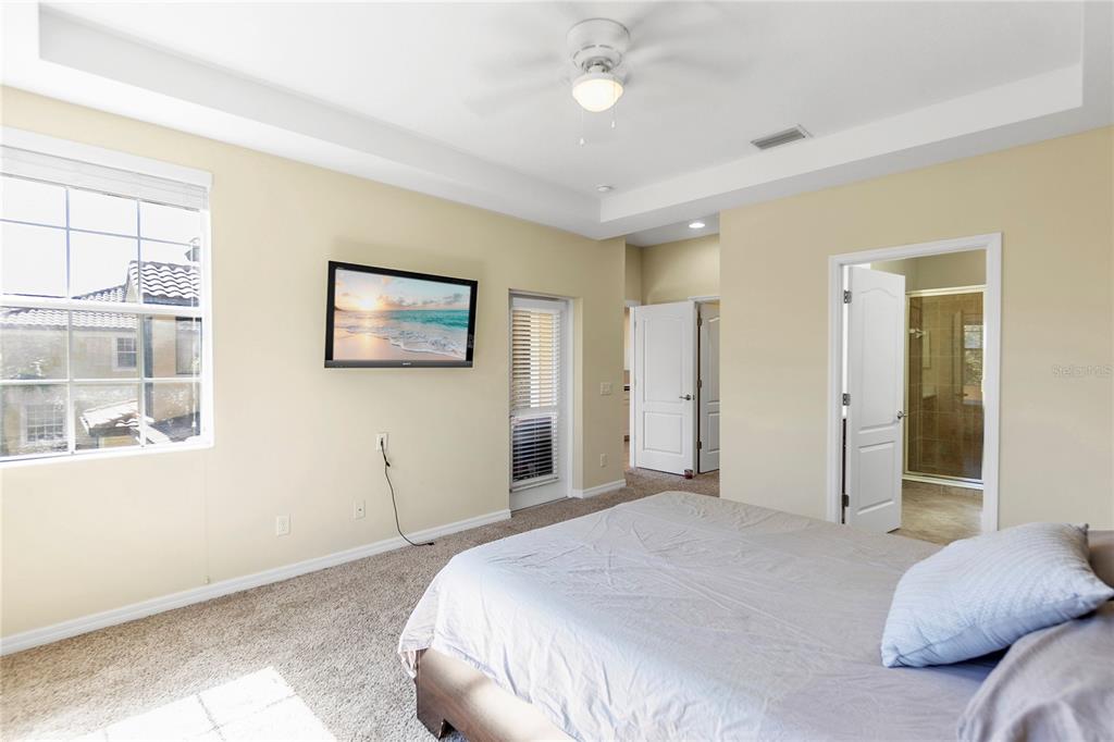 8141 Miramar Way, Unit 8141 Lakewood Ranch, FL 34202 - Photo 19 of 26 a bedroom with a large bed and a window