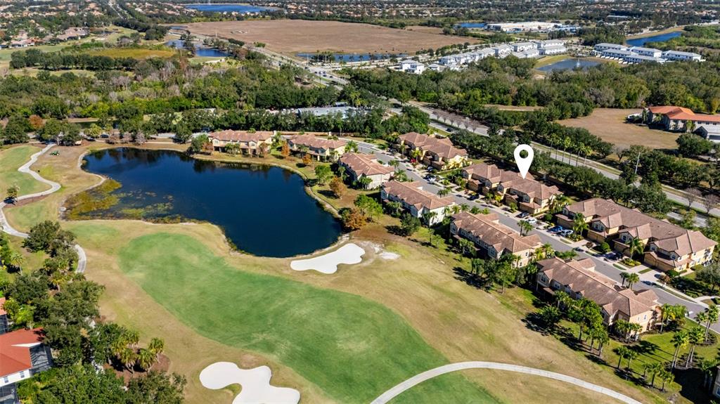 8141 Miramar Way, Unit 8141 Lakewood Ranch, FL 34202 - Photo 25 of 26 an aerial view of residential houses with outdoor space